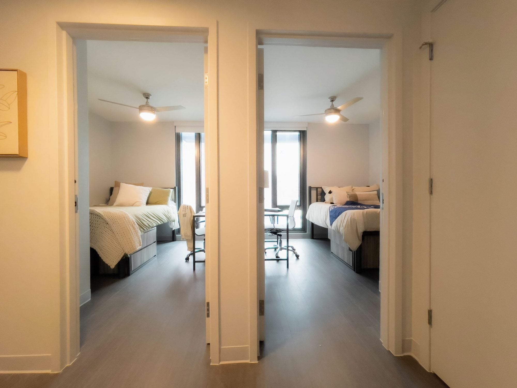 apartment interior showing entrances to two bedrooms side by side