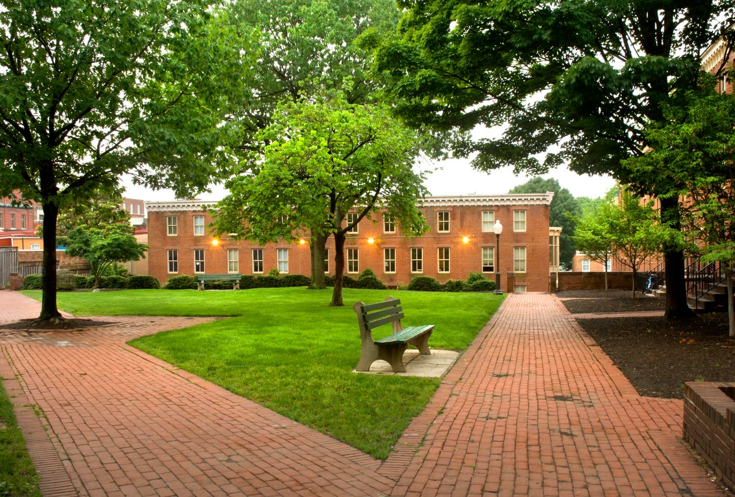 quad with brick buildings, paths, and trees