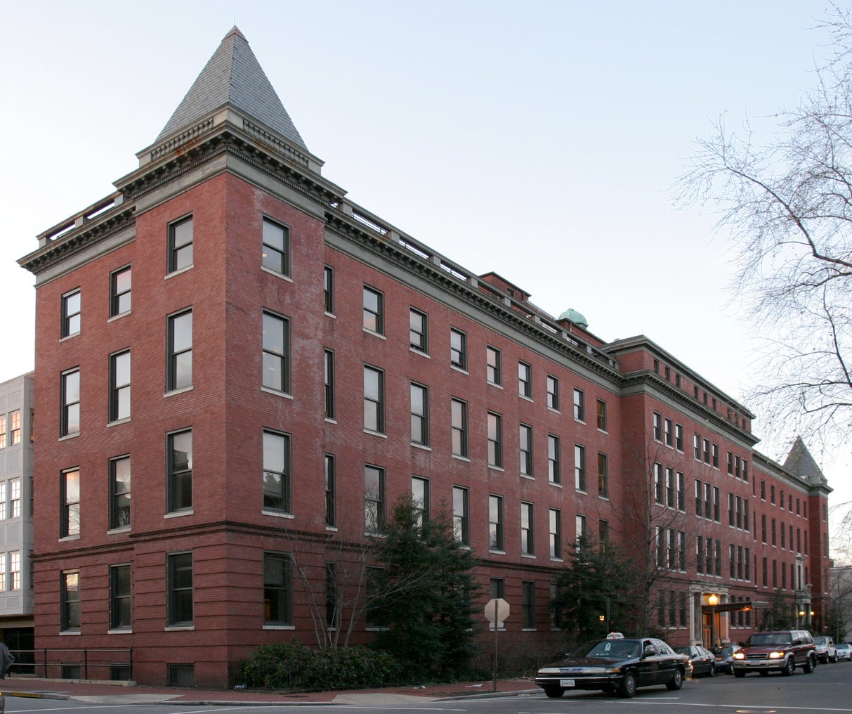 large red brick building with pointed roof