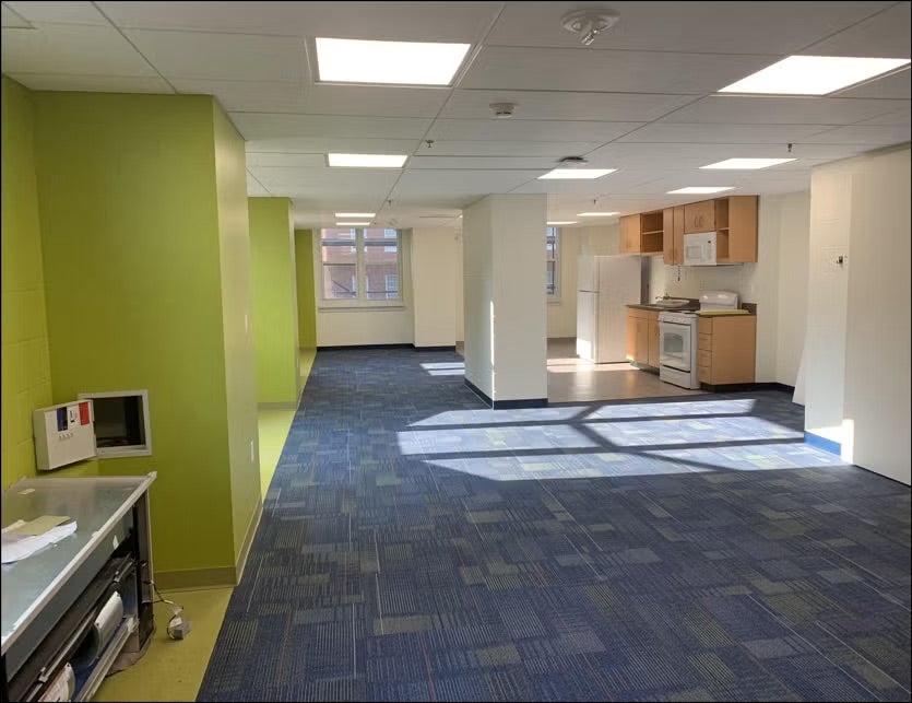 lobby with blue carpet and green walks
