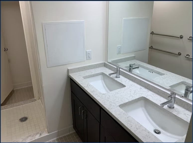 bathroom with tein sinks