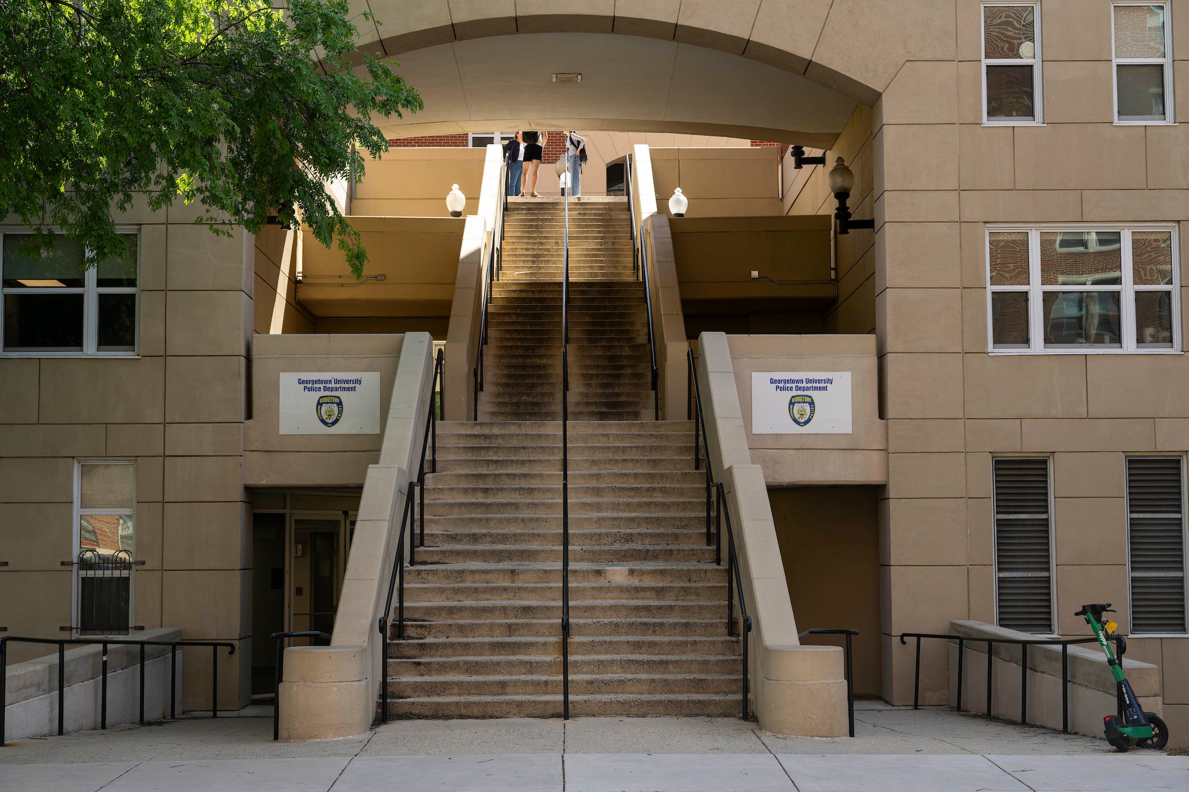 stone stairway under a building arch