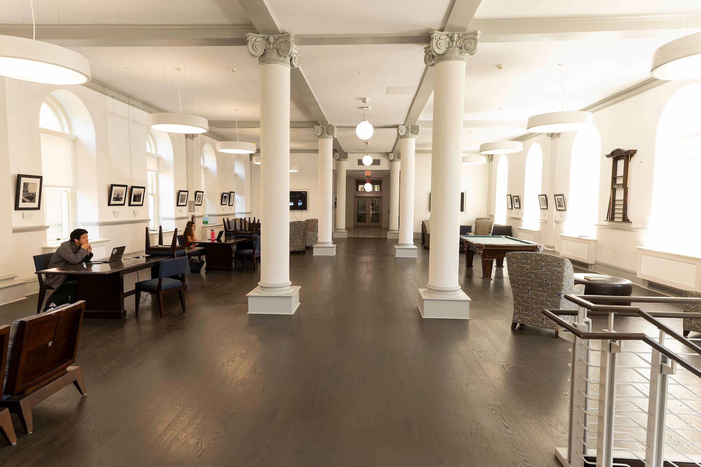 building interior lounge with furniture, pool table, and columns
