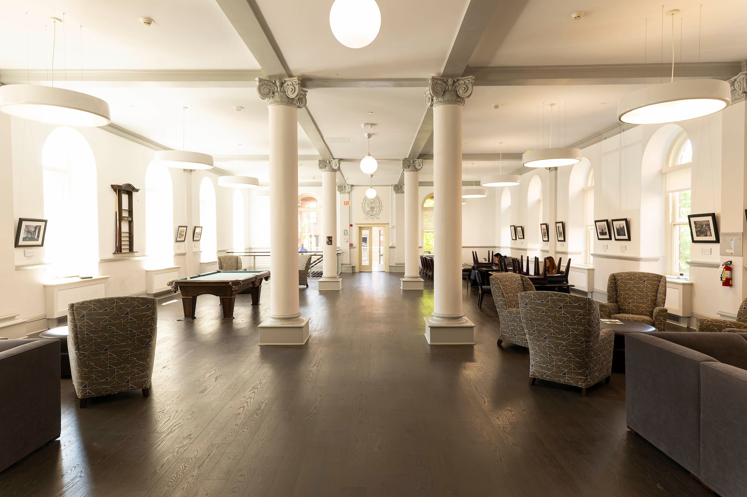 building interior lounge with furniture, pool table, and columns