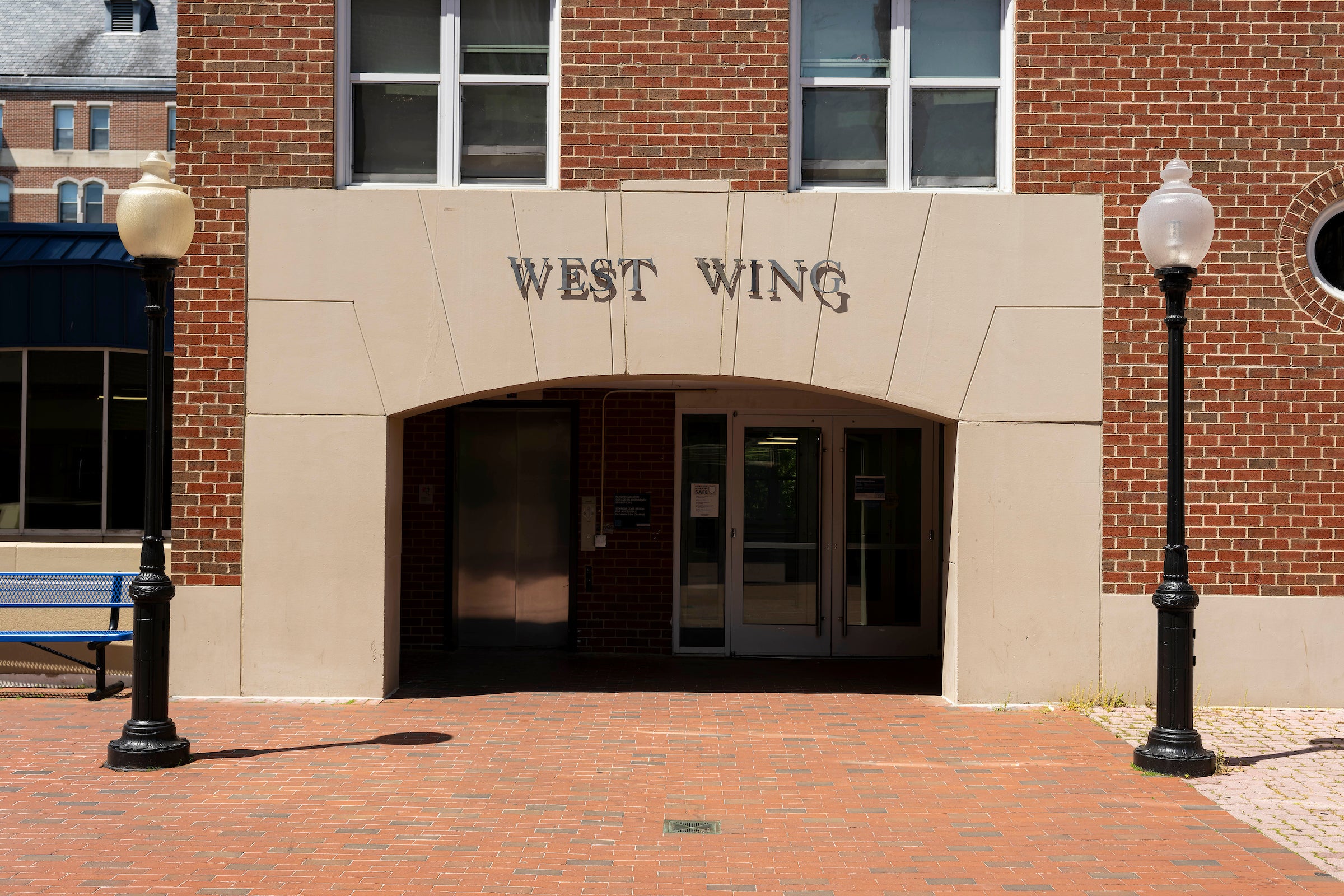 light brick entrance to a building that reads 