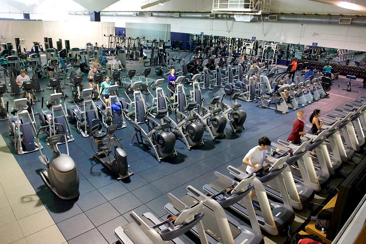 aerial view of a gym with rows and rows of cardio equipment